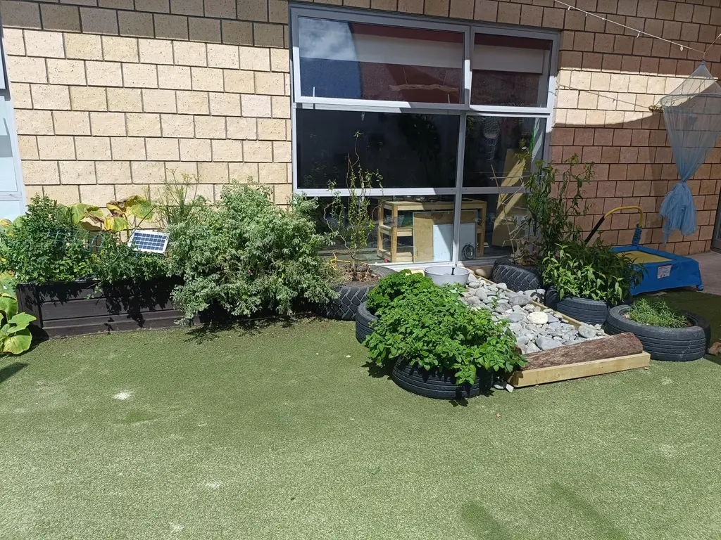 Harmony Haven garden area with planted beds and natural textures